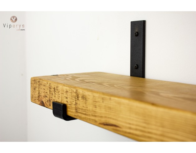 Close-up of black loft-style metal bracket Close-up of black loft-style metal bracket